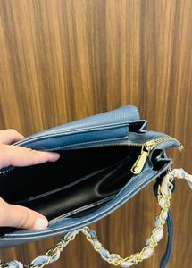 Chic Blue Crossbody Bag with Scarf Detail