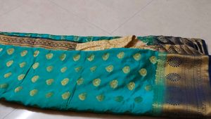 Elegant Teal Saree with Golden Brocade Border