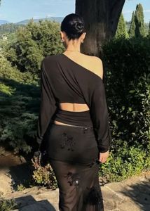 black solid one shoulder top