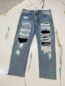 Distressed Blue Denim Jeans