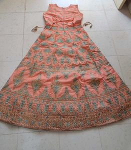 Ethnic peach gown with rich embroidery