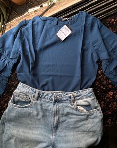 Blue top with cut work sleeves