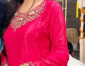 reduced price hot pink suit with handwork done