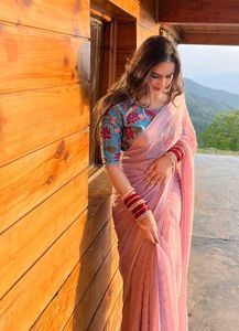 Elegant Pink Saree with Floral Blouse