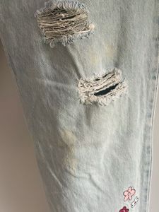 Ripped Jeans with Floral Embroidery