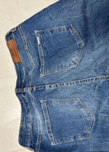 Distressed Blue Denim Jeans with Zipper Cuffs