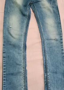 Distressed Blue Denim Jeans