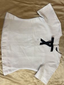 Chic White Top with Black Bow Detail