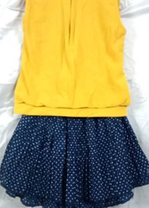 yellow top with navy blue skirt