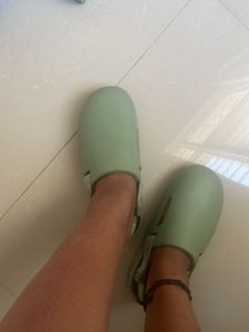 Mint Green Slides Nike brand.