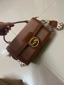 Chic Brown Crossbody Bag with Patterned Strap