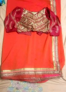 Stunning Orange Saree with Embroidered Blouse