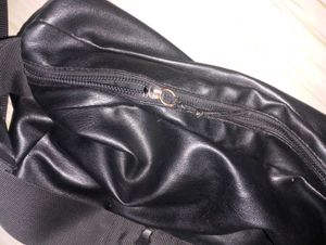 Black leather bag with adjustable strap