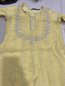 Elegant Yellow Kurta with Intricate Embellishments
