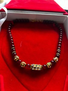 Elegant Beaded Necklace with Embellishments