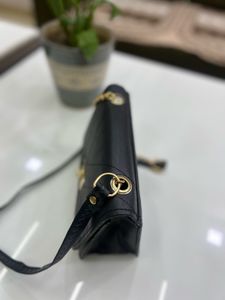 Chic Black Crossbody Bag with Chain Detail