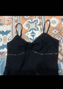 Chic Black Slip Dress with Embellished Neckline