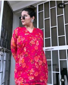 pink kurti with lining and lots of tussels