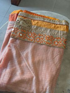 Elegant Orange Saree with Intricate Border