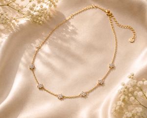 Delicate gold flower and 2 step necklace
