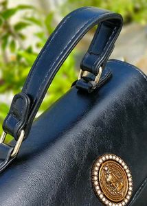 Chic Black Handbag with Embellished Detail