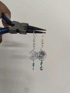 Silver Swirl Earrings with Blue Beads