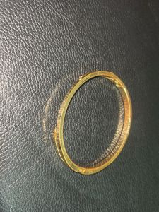 Elegant Gold Bangle with Roman Numerals