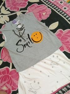 A Very Stylish And Good Looking Medium Sized Smiley 2 In One Top, Can Be A Long Top Also And Crop Also By Shirting In.