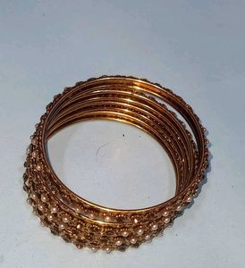 Elegant Gold Bangles with Pearl Embellishments