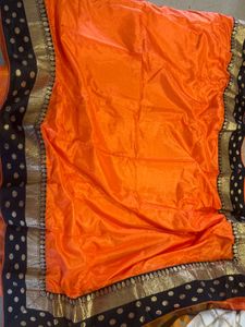 Elegant Orange Saree with Black &amp; Gold Border