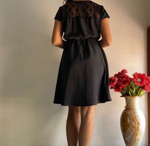 Elegant Black Dress with Lace Detail