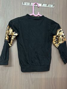 Black sequin sleeve top