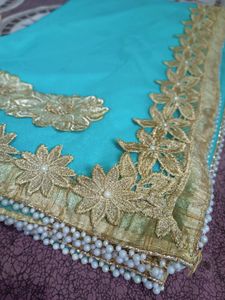 Elegant Turquoise Saree with Golden Embellishments