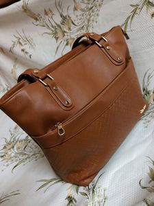 "Carry your essentials in style with this Handbag"