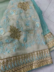 Elegant green Saree with Gold Border