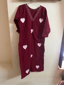 a deep marron colour kurta set