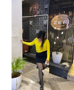 yellow top with black skirt