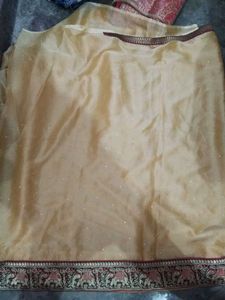 Elegant Golden Saree with Embellishments