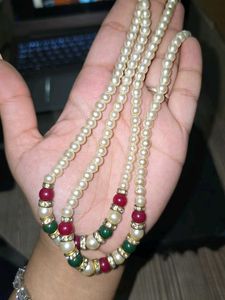 Red, green and white pearl necklace