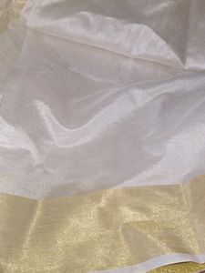 Elegant White and Gold Saree Onam