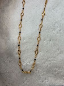 Elegant Gold Chain with Black Beads