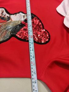 Chic Red Top with Sequin Embellishment