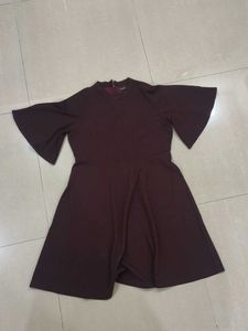 Women's Burgundy Bell Sleeve Dress with cut out.