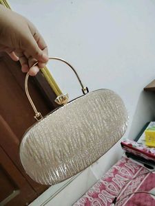 27.Sparkly Oval Clutch Bag