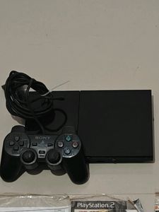 PS2 Console With 11 CD's (Non Working)
