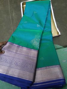 Elegant Teal Saree with Silver Zari Border