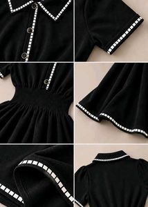 BLACK FIT AND FLARE DRESS WITH WHITE TRIM