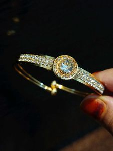Elegant Gold Tone Bangle Bracelet with CZ Stones