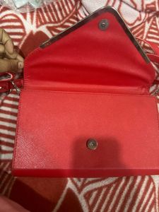 Red Sling Bag With CHANEL Logo