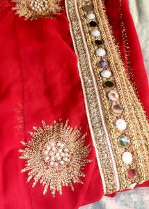 Red saree with mirror work border